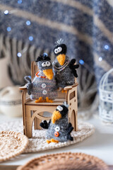 Knitted crow toys with decorations and shiny objects