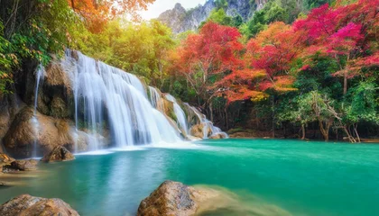 Fotobehang wonderful waterfall with colorful tree in thailand © joesph