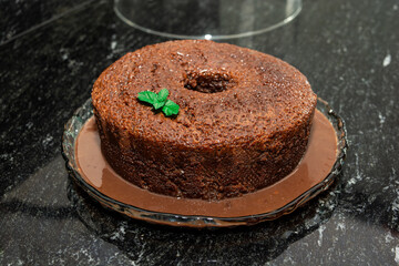 chocolate cake over a marble dark background