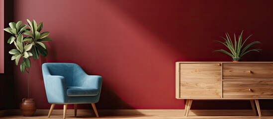 This photo showcases a living room featuring a blue chair and a wooden cabinet with a plant. The room has a warm ambiance with a touch of elegance.