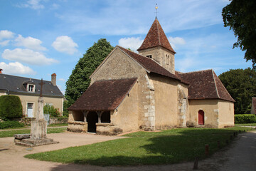 Fototapeta na wymiar medieval church (sainte-anne) and houses in a village (nohant-vic) in france
