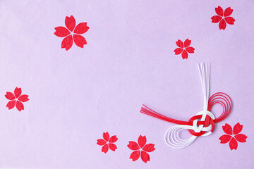 和紙の切り絵風デザインのフレーム　赤い桜の花と紅白の水引結び（薄紫の背景）