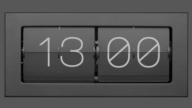 Flip clock quickly flips. Retro flip clock changing from 12:59 to 13:00. Slow motion. Close up.