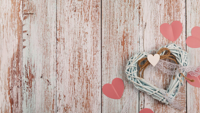 Romantic background. Wooden white background with red hearts, gifts