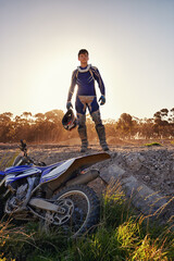 Portrait, motocross and rider by dirtbike in forest, confident and extreme sport for adventure with...