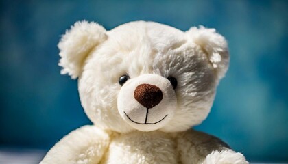 Beautiful teddy bear, children's plush toy. Blue bokeh