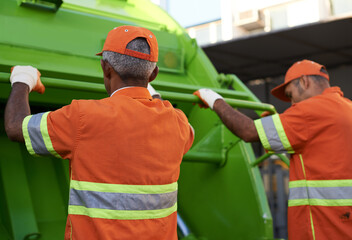 Garbage collector, men and truck for waste management and teamwork with routine and cleaning the...