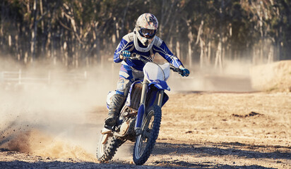 Motorcycle, action and speed with person riding on dirt track, adrenaline and skill for extreme...