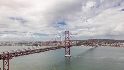 Panorama showing Lisbon cityscape and Tagus river timelapse with 25 of April bridge