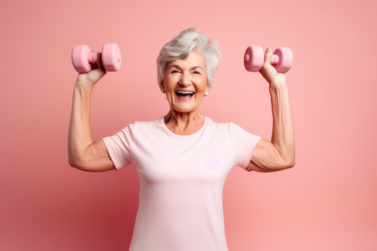 Smiling Senior Woman Exercising With Dumbbells At Home. Healthy Lifestyle Concept