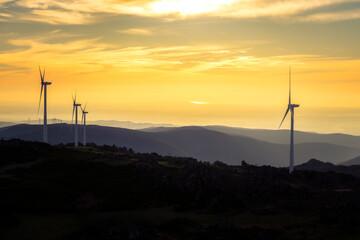 Landscape with renewable and sustainable energy with wind turbines on mountain, Portugal	