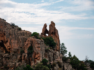 Drone photography of Calanches Piana and Porto ota city with rock cliffs and turquoise waters in Cap Corse