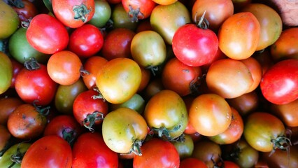 Top view ripe tomatoes in container
