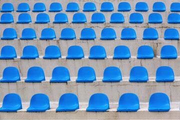 Fototapeta premium Plastic blue seats rows on street auditorium or stadium. No people