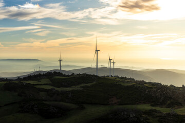 Landscape with renewable and sustainable energy with wind turbines on mountain, Portugal	