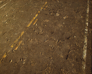 Worn out rough tarmac of an american highway. - 743715889