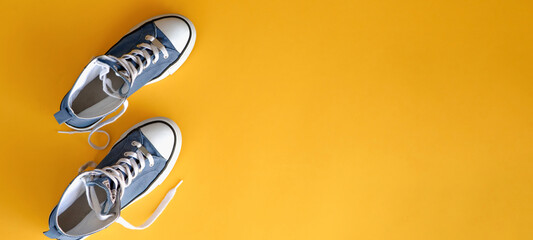 Sport. Shoes  on a yellow background. Fitness. Training. Copyspace for text.