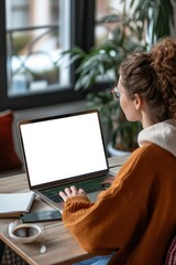 Over shoulder view of woman student elearning looking at white mock up blank screen using laptop computer learning online, remote working concept. Website display template for ads, Generative AI