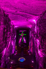 Illuminated cross representing stations of the cross, illustrate events of Jesus last journey, light in underground Catedral de Sal (Salt Cathedral) of Zipaquira, one of Colombian wonders, Colombia. - 743734621