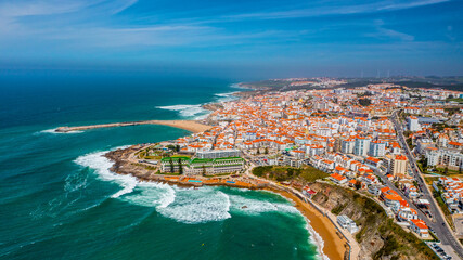 Drone aerial view over beaches, coastlines in Ericeira, Portugal, on summer sunny day. Aerial view to the Beautiful European touristic town. Beautiful cityscape with skyline, ocean rocky shore - 743748661