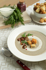 Cream soup of vegetables and champignons with croutons