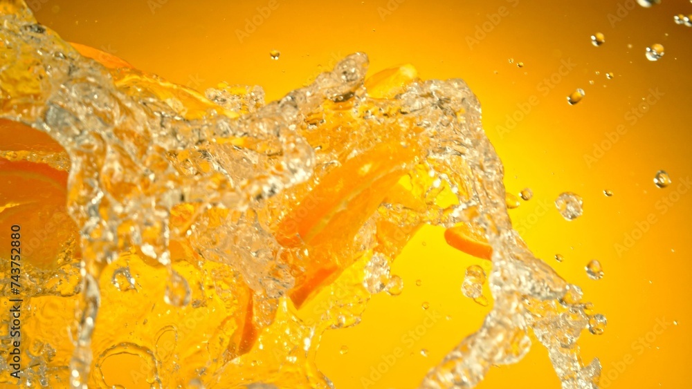 Aufkleber Freeze Motion of Flying Slices of Oranges with Splashing Water.
