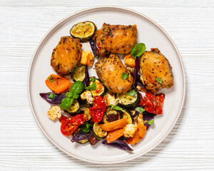 baked chicken thighs with veggies, olives, feta