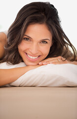 Smile, woman and portrait to wake up in bed, rest and calm on morning in home. Happy female person, pillow and ready for start of weekend in apartment, comfortable and peace or lazy for wellness