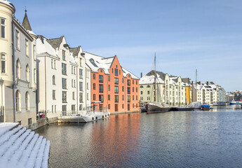 Obraz premium The Jugend city Aalesund (Ålesund) harbor on a beautiful cold winter's day. Møre and Romsdal county
