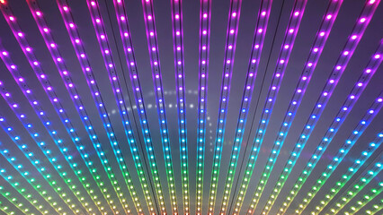 Abstract background. Amusement ride lights from a ferris wheel. Colorful attraction lights.