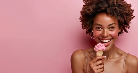 Close up of african american woman eating ice cream isolated on pink background
