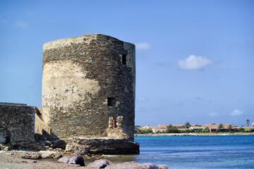 Scenic view of Saline tower against the scattered clouds at midday. Stintino, Sardinia. Italy 