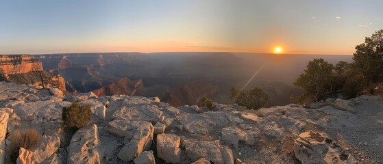Fototapeta premium Sunrise over the Grand Canyon, USA, painting the sky in hues of gold