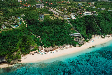 Luxury holiday beach with turquoise ocean and waves in Bali