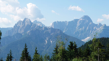 Border Tripoint Austria, Slovenia, Italy with sight on the Italian J&ocirc;f di Montasio mountains near Tarvisio. Taken on a sunny day high on top of the mountains. 