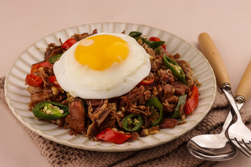 Beef Sisig is Filipino Food Served with Egg 