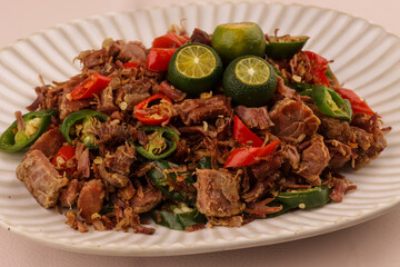 Beef Sisig is Filipino Food Served in a Plate. 