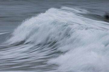 Close-up view of breaking wave in motion.