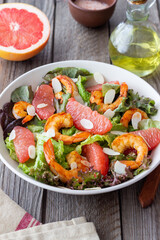 Salad with grapefruit, shrimps and almonds. Healthy eating. Diet.