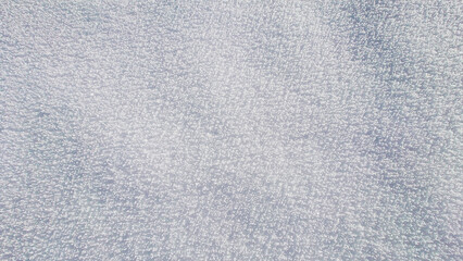 Snow textures after fresh snowfall, forming ice crystals on the ground and beautifull untouched snow cover.