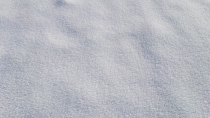 Snow textures after fresh snowfall, forming ice crystals on the ground and beautifull untouched snow cover.