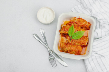 Cabbage rolls stuffed with rice and meat stewed in tomato sauce. Traditional dish, ready-to-eat food