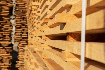 A close-up of a sawn board. The boards are stacked on the sawmill. Sawing boards on a sawmill