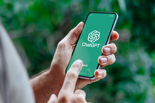 Man using ChatGPT in the mobile phone. This app is a chatbot based on Artificial Intelligence developed by OpenAI. 