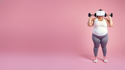 A determined woman in colorful workout clothes flexes her muscles as she lifts weights, showcasing the strength and power of the human body