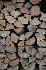 chopped neatly stacked firewood as background, texture of wooden firewood as background 