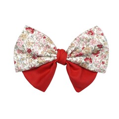 Vibrant hair bow with floral and red patterns on white background. Chic and versatile accessory for fashion projects.