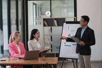 Professional team of business people planning and strategizing business plan together.