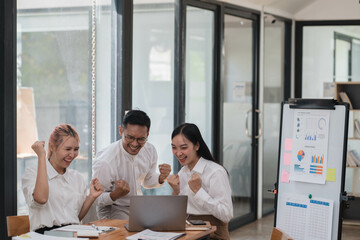 Happy business colleagues celebrating successful business year in the office room.