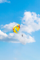 couple rides a parachute on vacation at sea. parasailing against the background of a cloudy sky